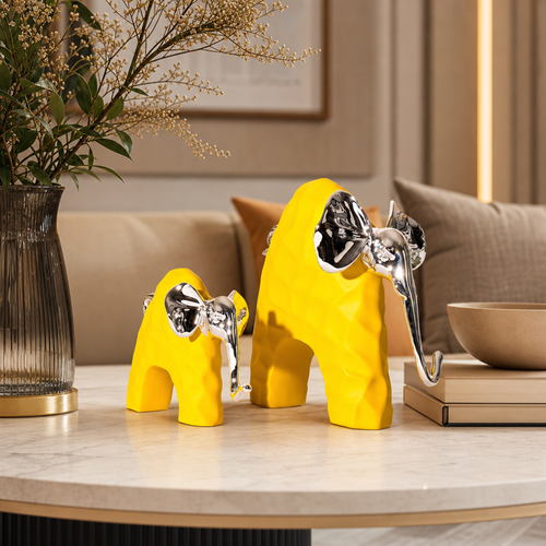 Glossy Yellow Elephant Pair with Silver Accents – Contemporary Tabletop Sculpture